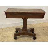 A mid 19th century rosewood card table, the fold over revolving top enclosing a baize lined