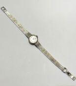 A lady's Vertex Revue white gold wristwatch with circular dial with baton hour markers on Milanese