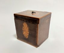 A Georgian mahogany inlaid tea caddy, the hinged top with fan style inlaid oval panel, with brass