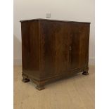 Whytock and Reid, a figured mahogany two door side cabinet, circa 1920s, with moulded edge over