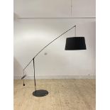 A contemporary adjustable lamp standard, black aluminium and plastic, on a circular base H202cm