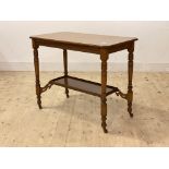 An Edwardian oak side table, the top with moulded edge and canted corners over ring turned