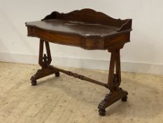 A Victorian mahogany console table, the three quarter galleried top over frieze drawer, raised on