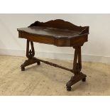 A Victorian mahogany console table, the three quarter galleried top over frieze drawer, raised on