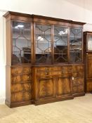 A Large Georgian style mahogany break front bookcase, the projecting cornice over four astragal