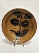 A Thorburn pottery bowl with stylised dark green leaf design, (8cm x 31cm), signed verso