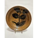 A Thorburn pottery bowl with stylised dark green leaf design, (8cm x 31cm), signed verso