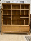 A Contemporary bespoke hardwood bookcase, the top section fitted with a combination of shelves and