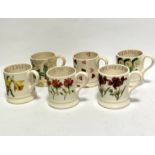 A group of six Emma Bridgewater pottery mugs including strawberry pattern, heart pattern and four