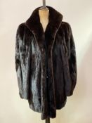 A 1980's dark mink jacket, silk-lined and bearing labels "MLG, Made by British Craftsmen" and "