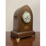 An Edwardian bracket clock, the mahogany case of lancet form inlaid with boxwood stringing and