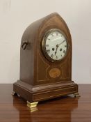 An Edwardian bracket clock, the mahogany case of lancet form inlaid with boxwood stringing and