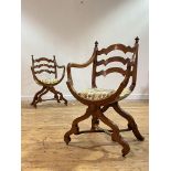 A pair of cherrywod X-frame chairs, early 20th century, the wavy splat back with turned finials over
