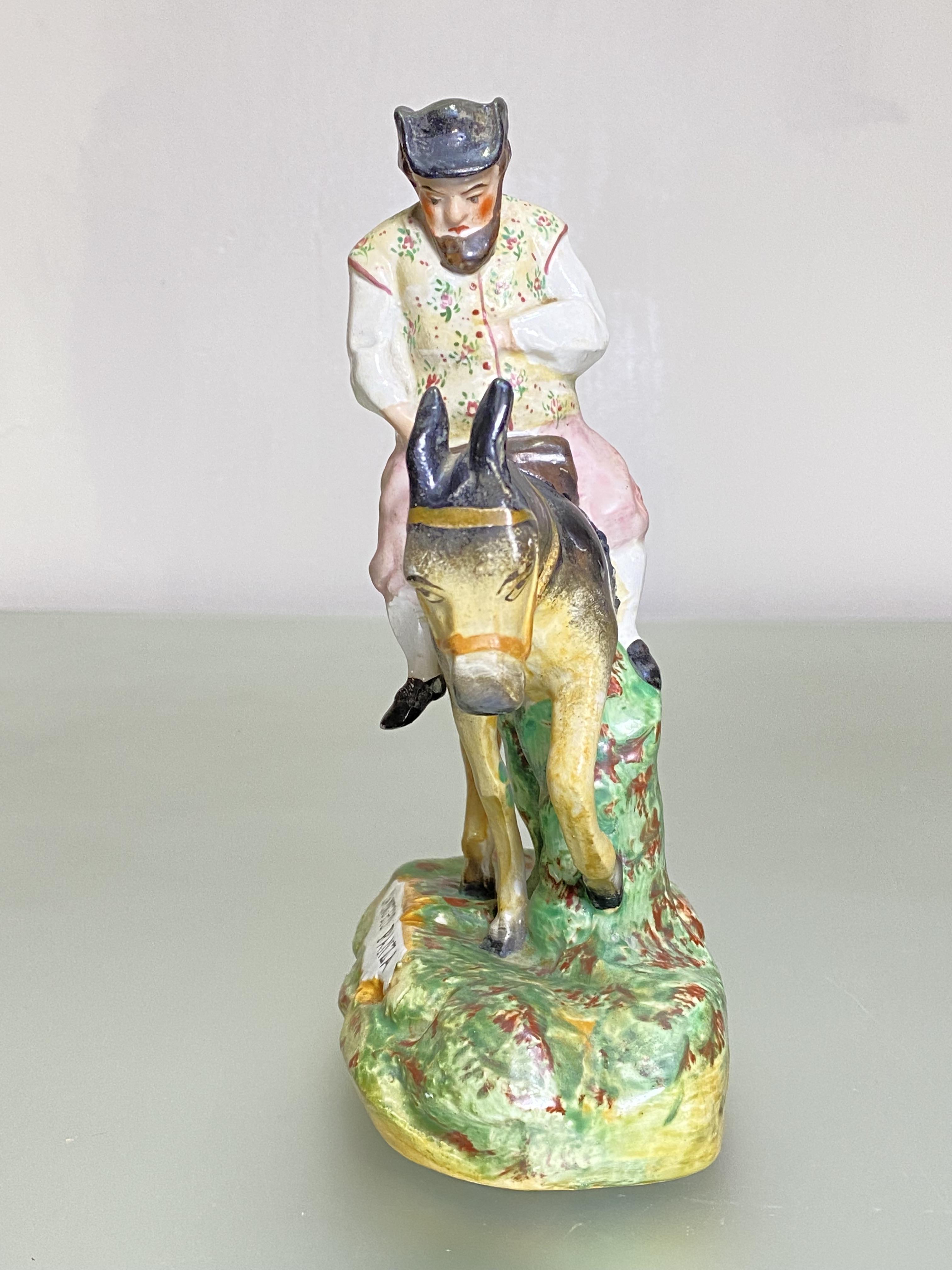 A 19th century Staffordshire figure of Sancho Panza, on a naturalistic base. Height 19.5cm - Image 2 of 5