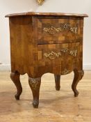 A French figured walnut chest of serpentine outline, circa 1900, the cross banded top with moulded