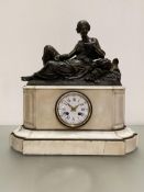 A 19th century French marble and patinated metal mantel clock, the figural surmount modelled as a