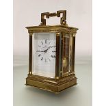 A Swiss brass-cased carriage clock for Matthew Norman Retailers, London, the lacquered brass case