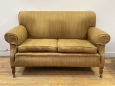 Whytock and Reid, an Edwardian mahogany framed two seat sofa, upholstered, with squab cushions,