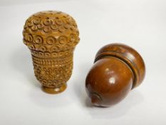Two early 19th century treen nutmeg graters: the first, of acorn form, opening to a grille (