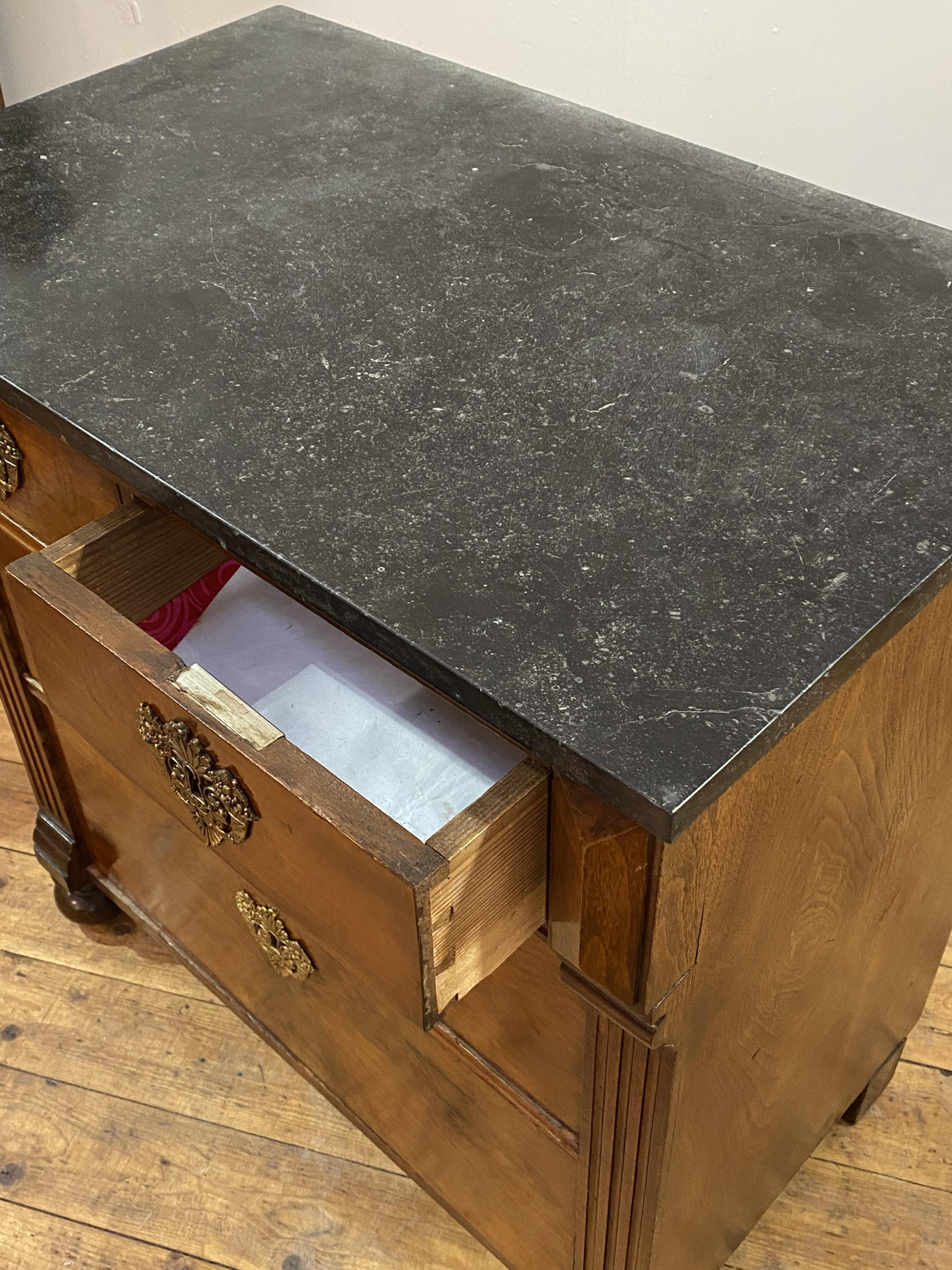 A late 19th century French walnut commode in the Empire taste, the black variegated marble top - Image 2 of 2
