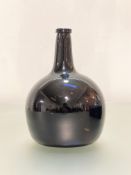 A brown glass onion wine bottle, late 18th/early 19th century. Height 24.5cm
