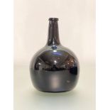 A brown glass onion wine bottle, late 18th/early 19th century. Height 24.5cm