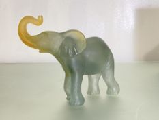 A Daum pate de verre model of an elephant, in smoky blue and amber glass, etched mark, in original