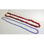 A group of jewellery comprising: a tanzanite bead necklace on a 9ct gold clasp; a coral chip