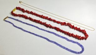 A group of jewellery comprising: a tanzanite bead necklace on a 9ct gold clasp; a coral chip