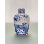 A 19th century Continental blue and white faience jar and cover, of baluster form, the slightly