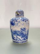 A 19th century Continental blue and white faience jar and cover, of baluster form, the slightly