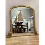 A Victorian gilt framed overmantel mirror, having an arched top and scrolled acanthus moulded
