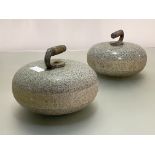 A pair of granite curling stones, each with wooden-inset handle (wood distressed). Diameter 27cm