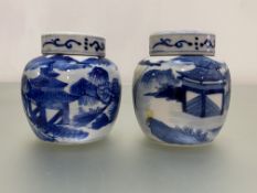 A pair of small Chinese blue and white porcelain jars and covers, each painted with figures in a