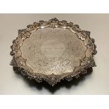 A William IV silver salver, John Welby, London 1831, the scalloped rim boldly chased with c-