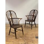 A matched pair of early Victorian elm, ash, and fruitwood Windsor armchairs, each double hoop and