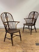 A matched pair of early Victorian elm, ash, and fruitwood Windsor armchairs, each double hoop and