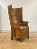 An Orkney chair, late 19th century, pine framed with woven back over arm rests with scrolled