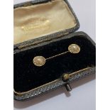 A late 19th century seed pearl and diamond bar brooch, the yellow metal (unmarked) knife-edge bar