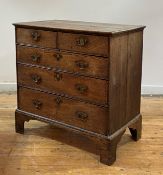 A George III vernacular oak chest of drawers, late 18th century, the top with moulded edge over