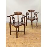 A pair of 19th century Chinese rosewood corner chairs, each with shaped crest rail over naturalistic