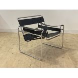 After Marcel Breuer, A Wassily chair, the tubular chrome frame with black sling leather seat, back