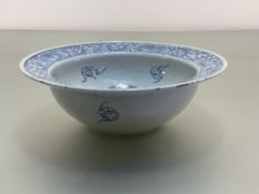 A Chinese blue and white porcelain basin, the well and broad rim painted with flowerheads amidst
