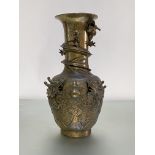 A large Chinese bronze baluster vase, c. 1900, cast in high relief with dragons and a flaming pearl,