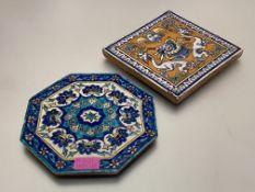 An octagonal pottery tile in an Iznik palette decorated with flowerheads; together with a tin-glazed