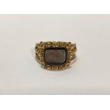 An early 19th century enamel and gold (untested) mourning ring, the glazed compartment containing