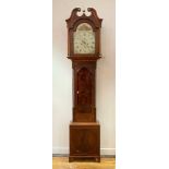 An early 19th century mahogany longcase clock, the swan neck pediment over arched hood door