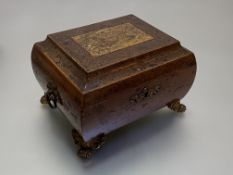 A 19th century gilt-metal mounted inlaid walnut work box, of compressed sarcophagus form, the