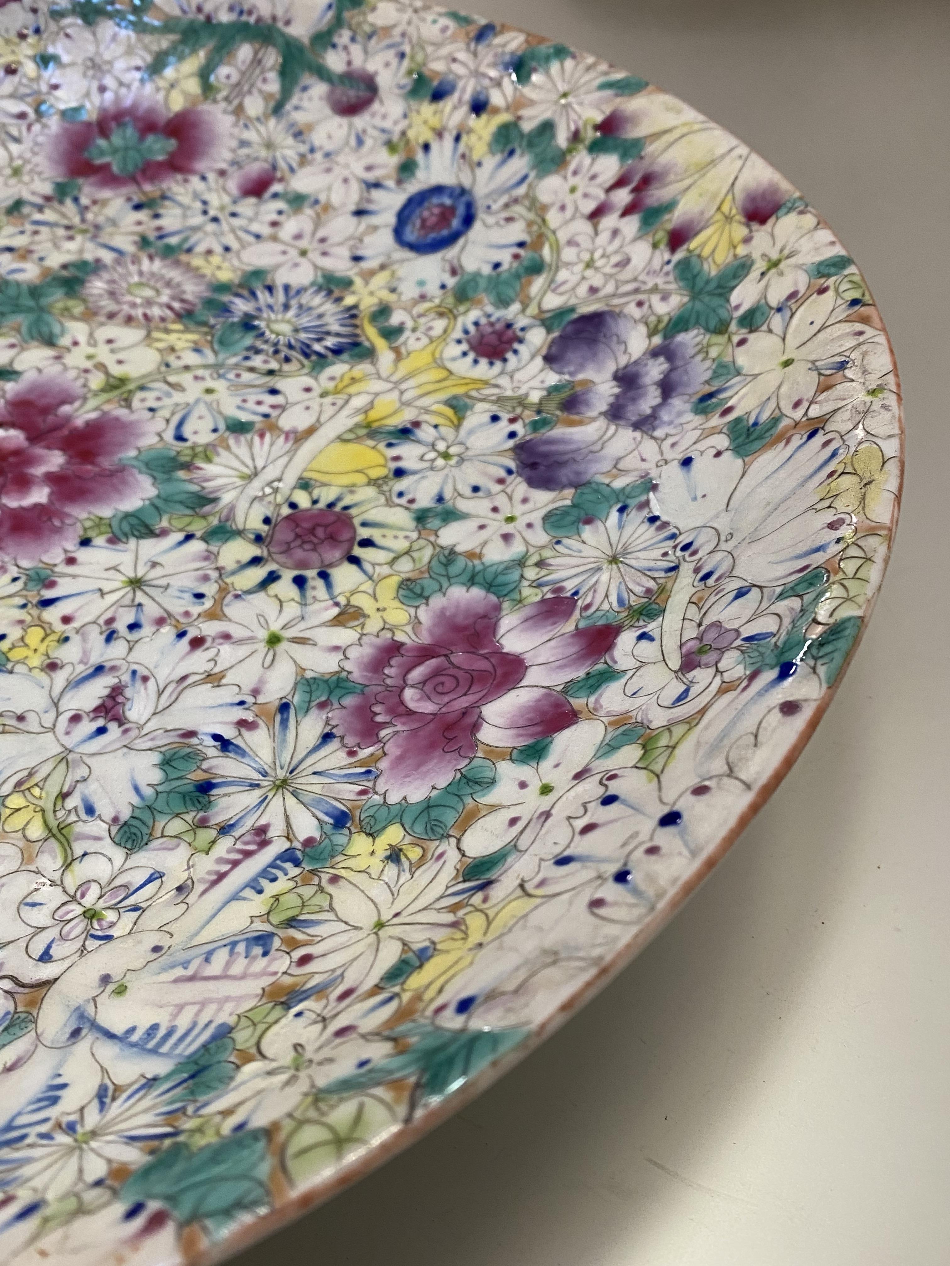 A Chinese famille rose millefleurs porcelain charger, with red six character mark of Guangxu type to - Image 2 of 4