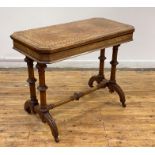 A Victorian figured walnut card table, the rectangular top with chamfered edge, canted corners and